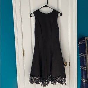 Black dress with detailing on the bottom
